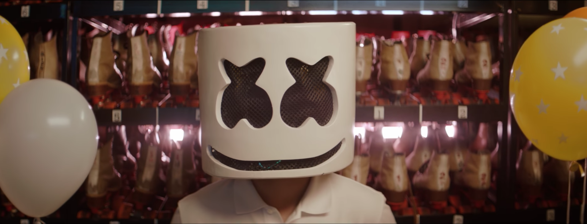 Marshmello falls in love at a roller rink in “Summer” music video