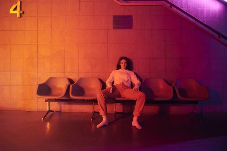 Dance through the halls with Glowie in her “Cruel” music video